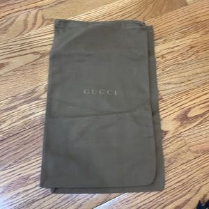 2 Brown Gucci dust bags